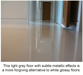 A light grey epoxy floor with a subtle metallic effect.